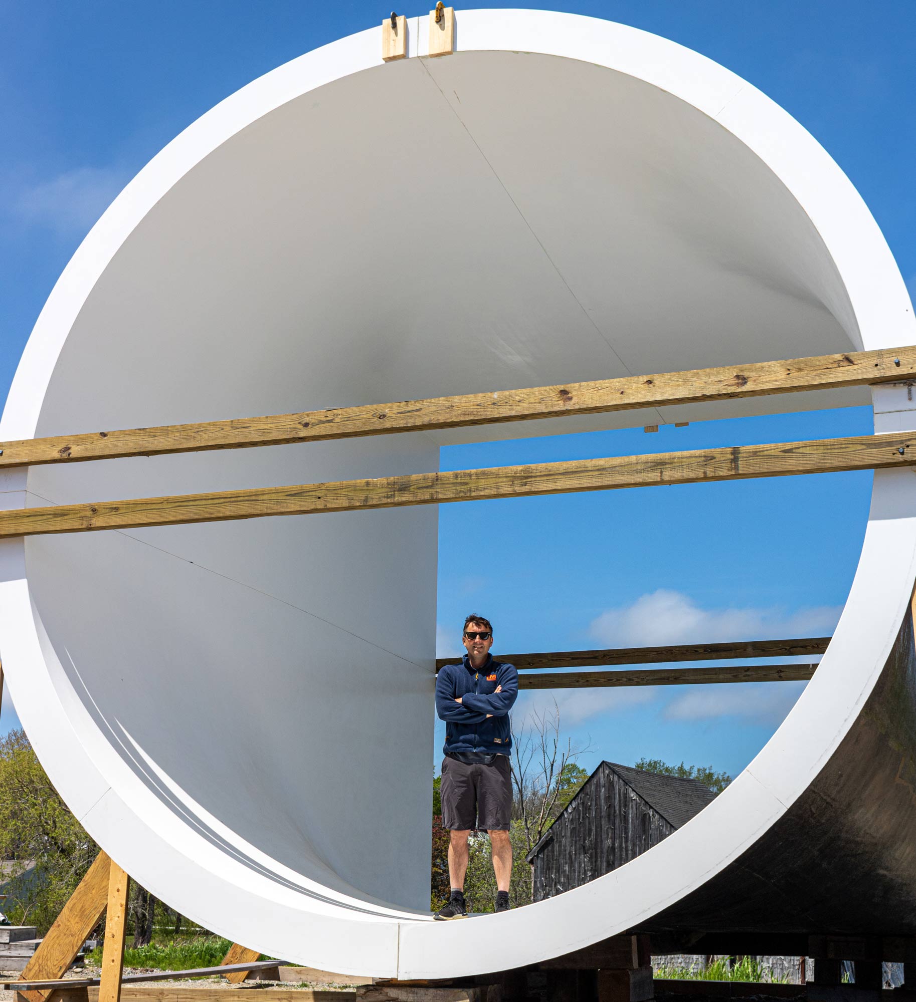 Drew Lyman poses in new wind tunnel built by Lyman-Morse Technologies